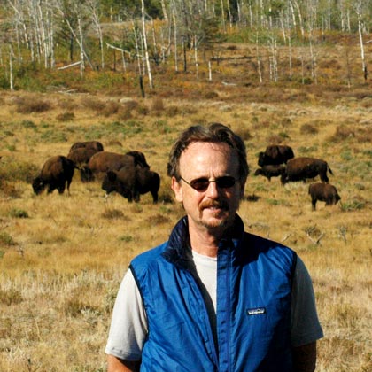 Kent Redford in front of a herd of buffalo